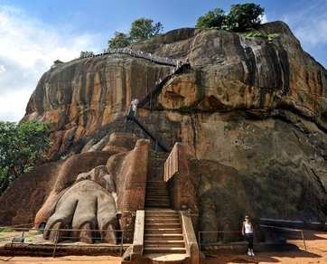 Sigiriya Rock Fortress rising majestically above the green jungle canopy in Sri Lanka